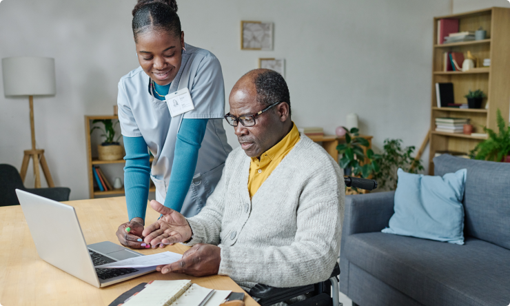 caregiver-helping-man-pay-bills (1)